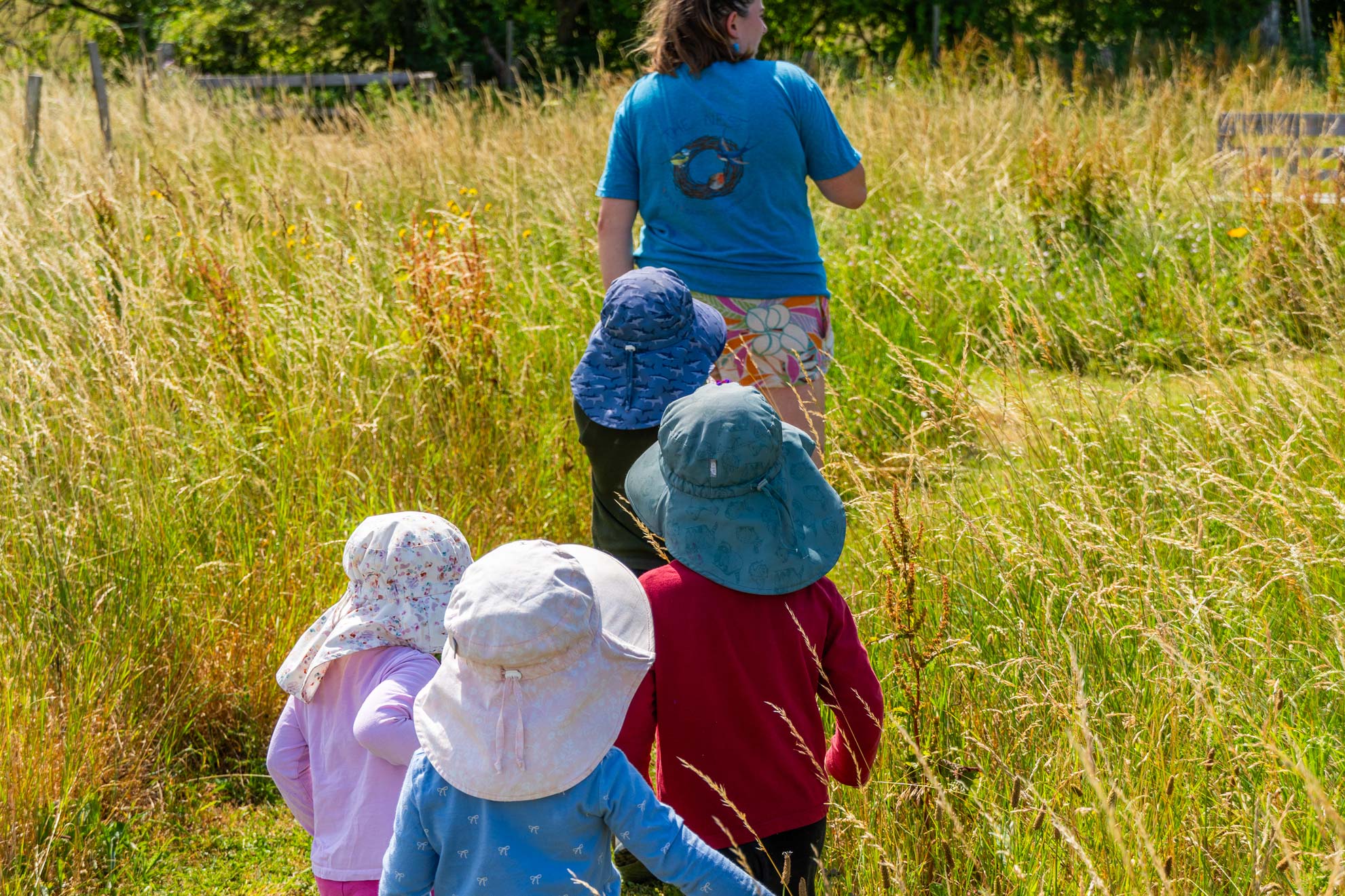 Nest staff leading a queue of children to their next activity at the Pheasant Nest