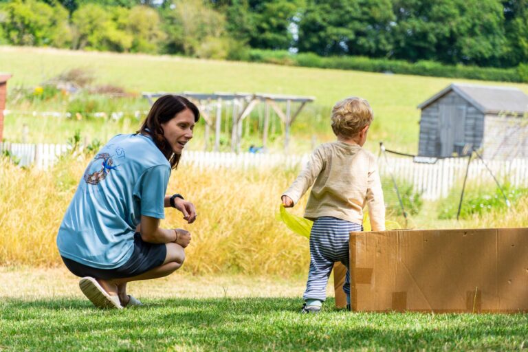 Fostering curiosity at the Pheasant Nest, staff member oversees outdoor play.