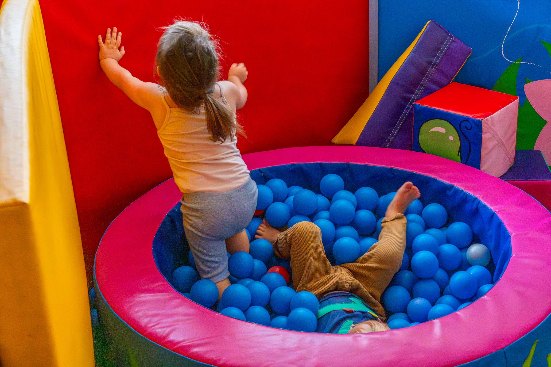 Having fun in the ball pit at the family Nest
