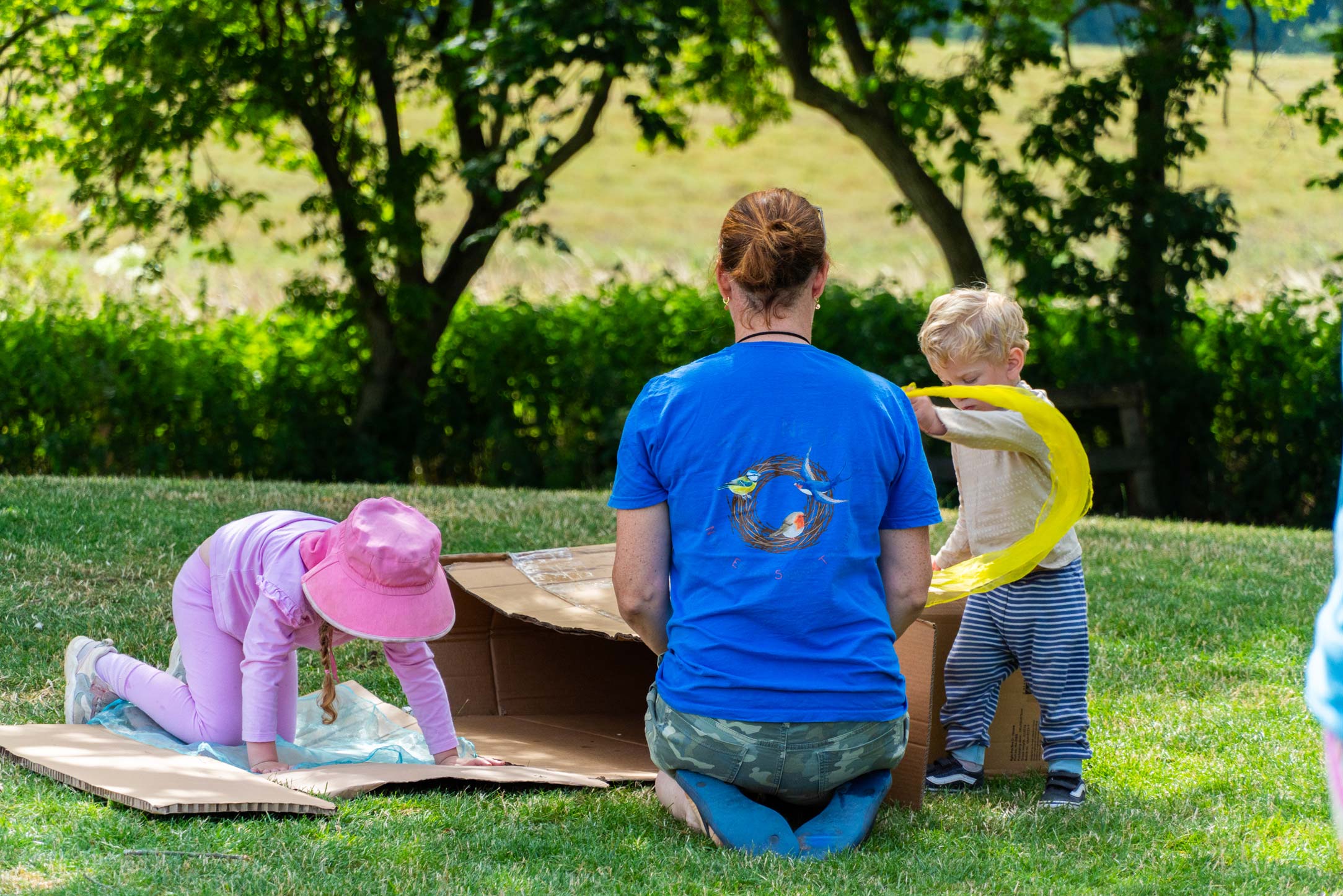 Creative outdoor play supervised by a Nest staff member at the Pheasant Nest